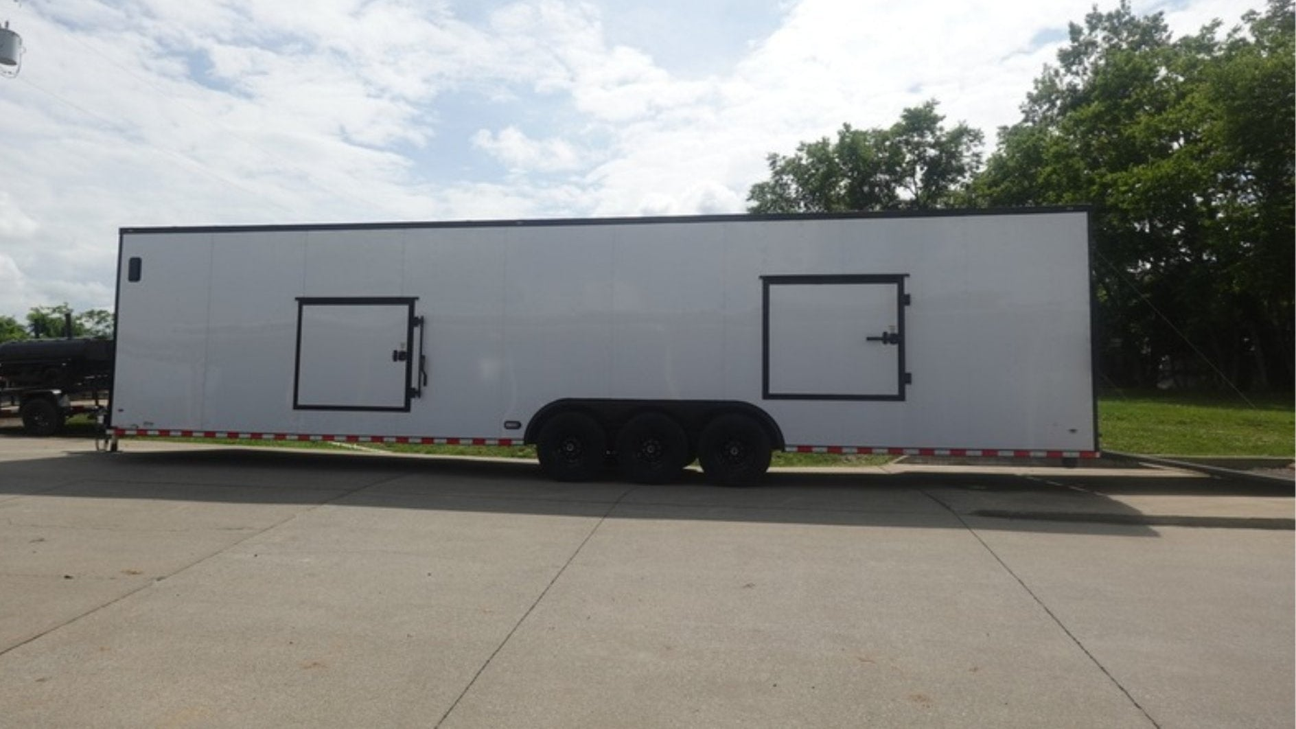 8.5X36 White With Black Out Enclosed Trailer With Escape Doors E Track Floor (3) 7K Axles 21K GVWR - Image 7